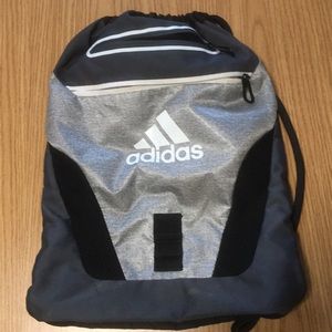 Drawstring bag: brand is “Adidas”